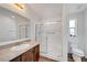 Bathroom featuring a glass-enclosed shower, spacious vanity, and a modern toilet at 5725 N Durango Dr, Las Vegas, NV 89149