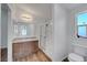 Well-lit bathroom features a modern vanity, glass-enclosed shower, and toilet at 5725 N Durango Dr, Las Vegas, NV 89149