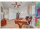 This bedroom features a ceiling fan and lots of natural light from the windows at 5725 N Durango Dr, Las Vegas, NV 89149