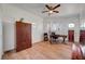 This bedroom features a ceiling fan and multiple windows for lots of natural light at 5725 N Durango Dr, Las Vegas, NV 89149