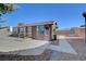 Cozy home featuring desert landscaping, neutral paint, and a walkway leading to the front entrance at 5725 N Durango Dr, Las Vegas, NV 89149