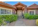 Inviting front entrance with manicured hedges and a charming walkway leading to the front door at 5725 N Durango Dr, Las Vegas, NV 89149