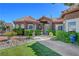 Charming home with a well-manicured lawn, lovely landscaping, and a welcoming entrance at 5725 N Durango Dr, Las Vegas, NV 89149