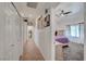 Bright hallway leading to a bedroom, featuring modern decor and closet space at 5725 N Durango Dr, Las Vegas, NV 89149