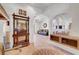 Stylish hallway with arched openings and decorative furniture leading to other rooms at 5725 N Durango Dr, Las Vegas, NV 89149