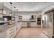 Bright kitchen with granite countertops, stainless steel appliances, and ample cabinet space at 5725 N Durango Dr, Las Vegas, NV 89149