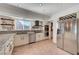 Well-lit kitchen featuring stainless steel appliances, double ovens, and a built-in wine rack at 5725 N Durango Dr, Las Vegas, NV 89149