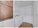 Laundry room features modern washer and dryer with overhead shelving and access to the backyard at 5725 N Durango Dr, Las Vegas, NV 89149