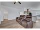 Bright, open concept living room with reclining leather chairs and lots of natural light at 5725 N Durango Dr, Las Vegas, NV 89149
