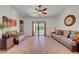 This living room features lots of light from the sliding doors and tile flooring at 5725 N Durango Dr, Las Vegas, NV 89149
