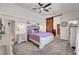 Inviting main bedroom featuring a cozy bed, dresser, and barn-style door at 5725 N Durango Dr, Las Vegas, NV 89149