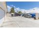 Large backyard area with garage, dome and covered items at 60 N Fogg St, Las Vegas, NV 89110
