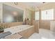 Bright bathroom with a large tub and glass enclosed shower at 60 N Fogg St, Las Vegas, NV 89110