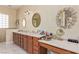 Bathroom with double vanity, countertop, and decorative mirrors at 60 N Fogg St, Las Vegas, NV 89110