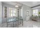 Inviting dining area with a glass table, modern chairs and ample natural light, perfect for Gathering meals at 60 N Fogg St, Las Vegas, NV 89110