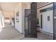 Covered entry showcasing an ornamental security door, tiled floor, and stylish trim at 60 N Fogg St, Las Vegas, NV 89110