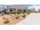 Charming single-story house with xeriscaping, long driveway, and mature landscaping at 60 N Fogg St, Las Vegas, NV 89110