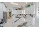 Modern kitchen with an island, white cabinets, and stainless steel appliances, perfect for culinary enthusiasts at 60 N Fogg St, Las Vegas, NV 89110