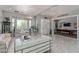 Bright living room featuring tile floors, modern chandelier, and ample seating at 60 N Fogg St, Las Vegas, NV 89110