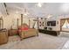 Open main bedroom featuring a four-poster bed, fireplace, and large windows at 60 N Fogg St, Las Vegas, NV 89110