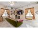 Cozy bedroom area featuring a fireplace, large TV, and natural lighting at 60 N Fogg St, Las Vegas, NV 89110