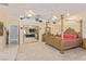 Spacious main bedroom with mirrored closet doors and four poster bed at 60 N Fogg St, Las Vegas, NV 89110