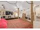 Bedroom featuring a four-poster bed, sitting area, and fireplace with TV at 60 N Fogg St, Las Vegas, NV 89110