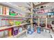 Walk-in pantry featuring built-in shelving with food and household items at 60 N Fogg St, Las Vegas, NV 89110