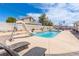 Sparkling pool with a fun slide and a seating area, perfect for outdoor enjoyment at 60 N Fogg St, Las Vegas, NV 89110