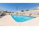 Inviting pool with slide and surrounding patio, ideal for summer relaxation and fun at 60 N Fogg St, Las Vegas, NV 89110
