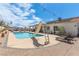 Wonderful pool and slide with patio seating and lush landscaping at 60 N Fogg St, Las Vegas, NV 89110