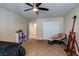 Bedroom showcasing a ceiling fan, closet, and a comfortable seating area with a soft, cushioned chair at 6403 Brandon Hills Ct, Las Vegas, NV 89139