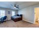 Bedroom featuring a ceiling fan, a desk, and a full bathroom, creating a private and comfortable space at 6403 Brandon Hills Ct, Las Vegas, NV 89139