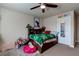 This bedroom features a ceiling fan, soft carpet and ample storage at 6403 Brandon Hills Ct, Las Vegas, NV 89139