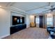 Bonus room with large TV on console, natural light and seating area at 6403 Brandon Hills Ct, Las Vegas, NV 89139