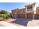 Stunning two-story home featuring a grand entrance with a three car garage and immaculate brick paved driveway at 6403 Brandon Hills Ct, Las Vegas, NV 89139