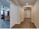 Beige hallway with neutral carpet that leads into the spacious carpeted main bedroom at 6403 Brandon Hills Ct, Las Vegas, NV 89139