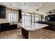Beautiful kitchen features granite counters, island, stainless steel appliances, and dark cabinetry at 6403 Brandon Hills Ct, Las Vegas, NV 89139