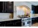 A chef's dream, featuring stainless steel range oven and granite countertops at 6403 Brandon Hills Ct, Las Vegas, NV 89139