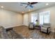 Bright and airy living area with ample seating, wood-look floors, and large windows for natural light at 6403 Brandon Hills Ct, Las Vegas, NV 89139