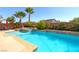 Inviting backyard pool and spa area perfect for outdoor relaxation and entertaining with lush landscaping at 6403 Brandon Hills Ct, Las Vegas, NV 89139