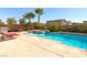 Beautiful backyard oasis with a refreshing pool, spa, and comfortable lounge area for relaxation at 6403 Brandon Hills Ct, Las Vegas, NV 89139