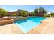 Pool featuring a built-in hot tub, well maintained landscaping, and a basketball hoop for recreation at 6403 Brandon Hills Ct, Las Vegas, NV 89139