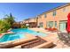 Inviting backyard with sparkling pool, spa, patio, and lush landscaping for ultimate outdoor living at 6403 Brandon Hills Ct, Las Vegas, NV 89139