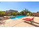 Resort-style backyard features a sparkling pool, spa, and ample patio space for outdoor enjoyment at 6403 Brandon Hills Ct, Las Vegas, NV 89139