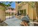 Backyard patio area with a grill, seating and manicured landscaping, perfect for outdoor dining at 6437 Boatbill St, North Las Vegas, NV 89084