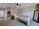 Spacious bedroom with ceiling fan, and doorway leading to a walk-in closet at 6437 Boatbill St, North Las Vegas, NV 89084