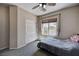 Cozy bedroom featuring a ceiling fan, large window, and closet at 6437 Boatbill St, North Las Vegas, NV 89084