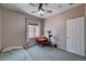 Bedroom featuring neutral walls, a large window, and a ceiling fan at 6437 Boatbill St, North Las Vegas, NV 89084