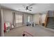 Bonus Room featuring neutral carpet, ceiling fan, and natural lighting at 6437 Boatbill St, North Las Vegas, NV 89084